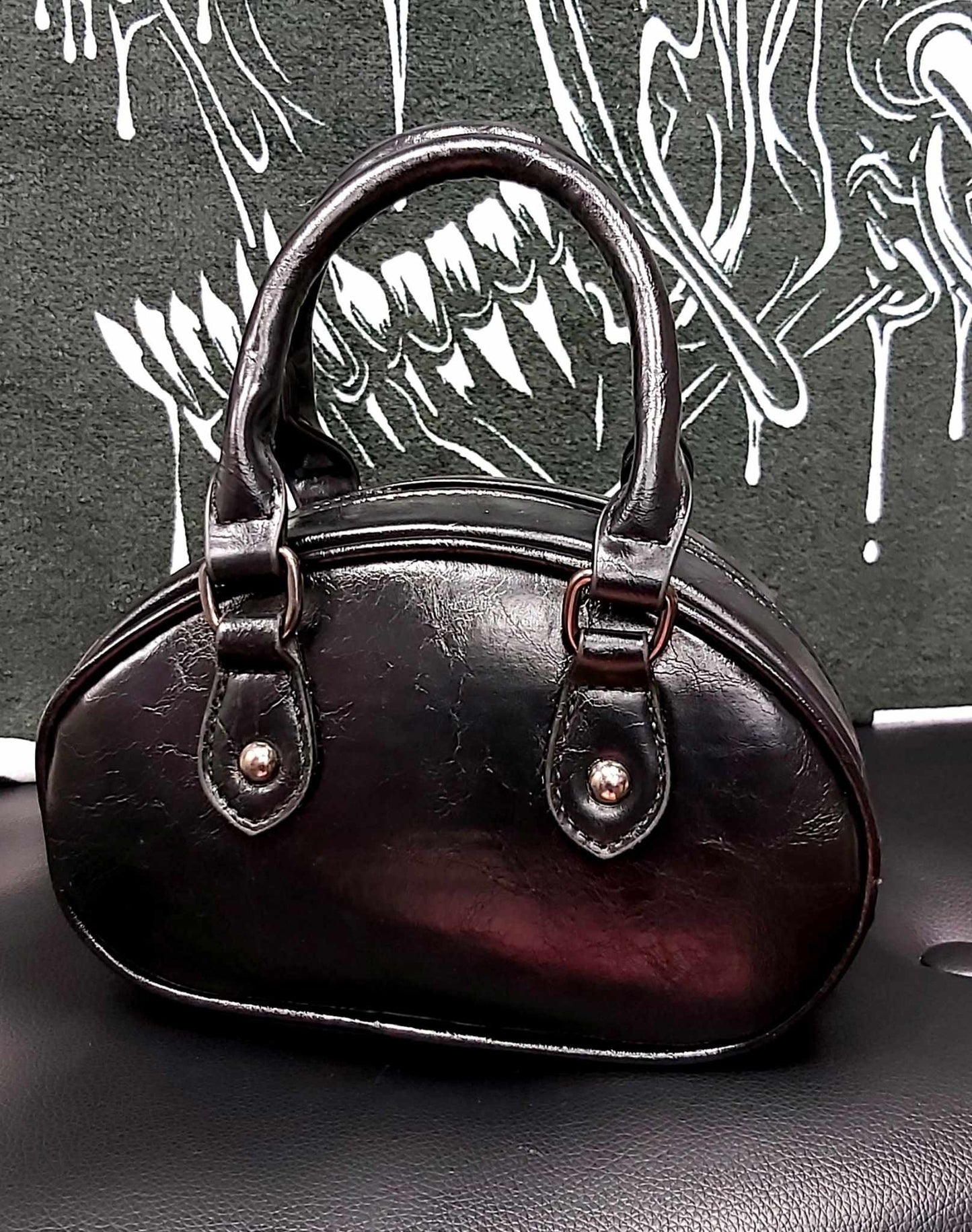 Small black faux leather handbag