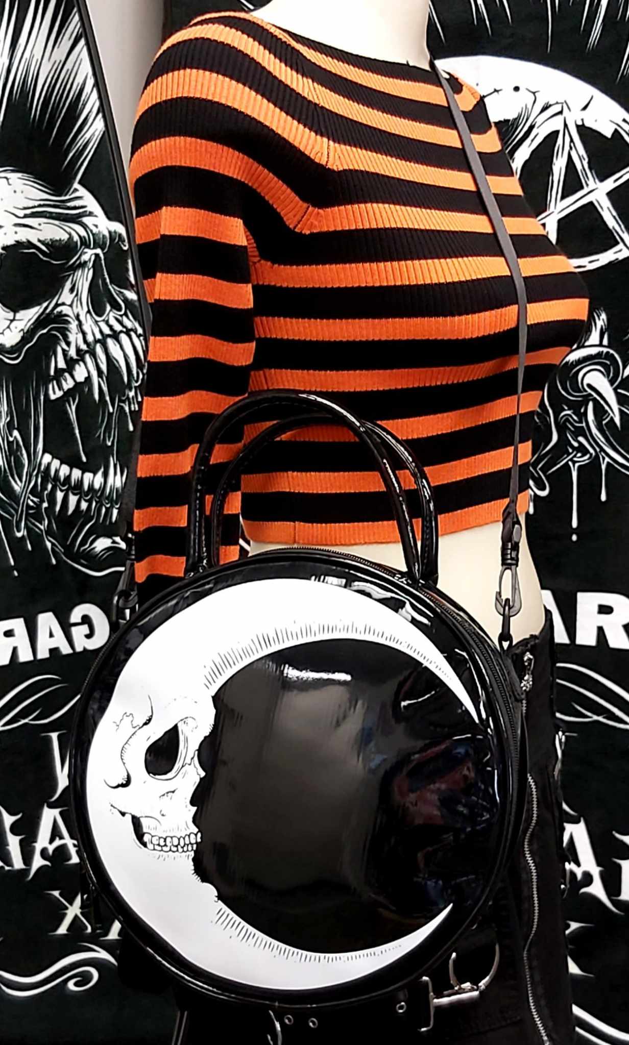 Quarter moon face on round purse
