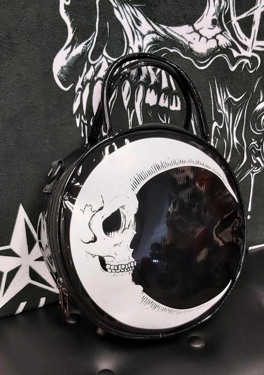 Quarter moon face on round purse